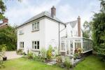 Evolution Storm Windows have been installed in this property in cream, against the rendered walls this gives the property a fresh and bright look